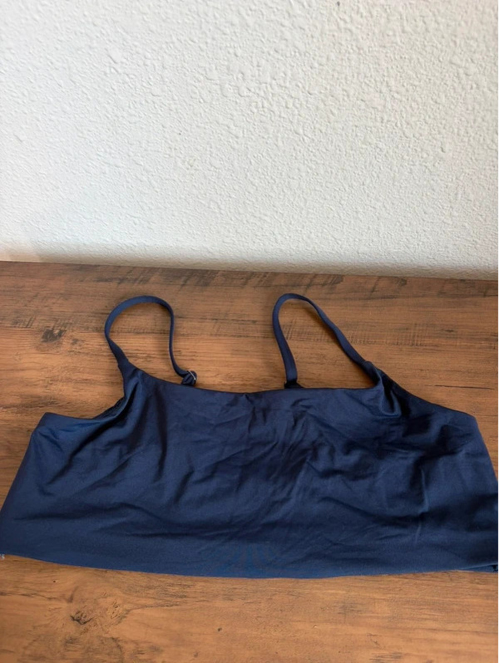 Athleta navy swim top size XL. Boning on the sides. No removable pads